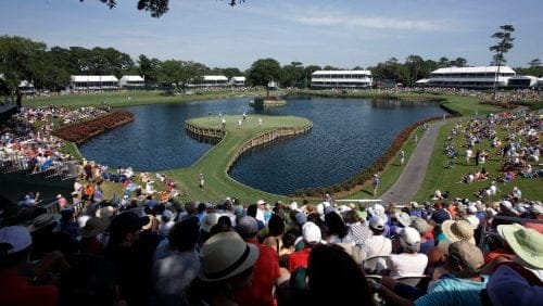 Golfers play the 17th hole during the second round of The Players championship golf tournament at TPC Sawgrass, Friday, May 9, 2014, in Ponte Vedra Beach, Fla.