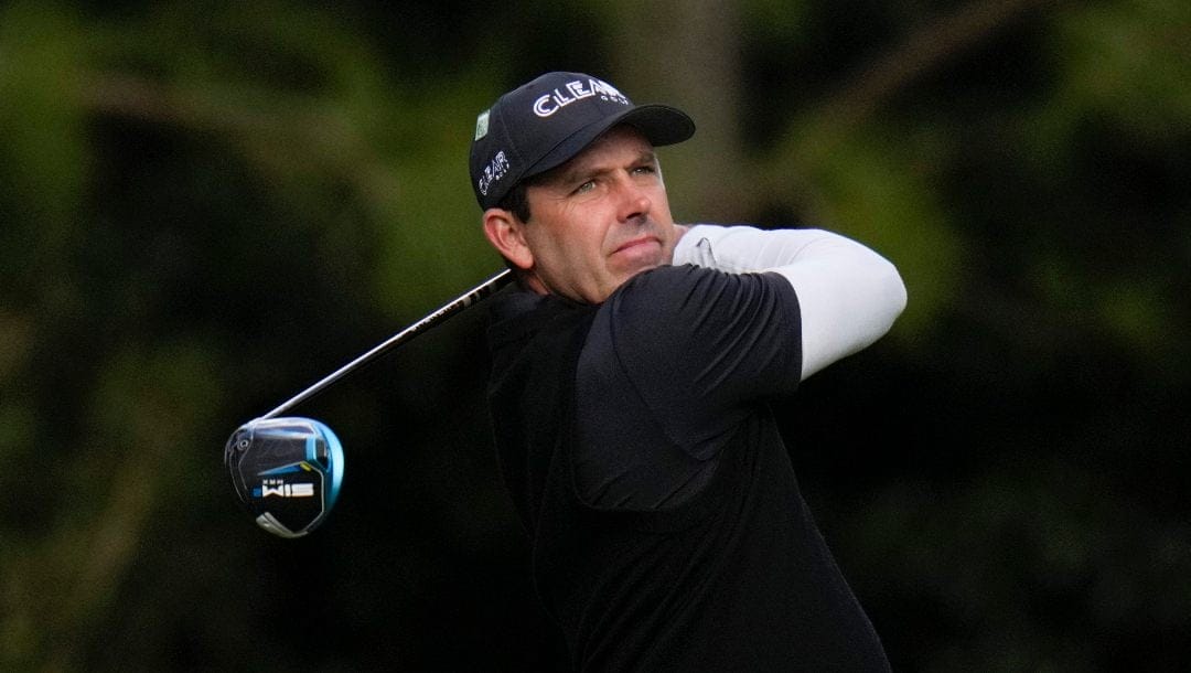 Charl Schwartzel, of South Africa, tees off on the 11th hole during the third round at the Masters golf tournament on Saturday, April 9, 2022, in Augusta, Ga.