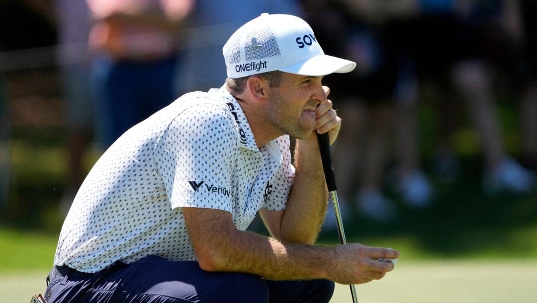 Denny McCarthy lines up his putt on the seventh green during the third round of the St. Jude Championship golf tournament Saturday, Aug. 17, 2024, in Memphis, Tenn.