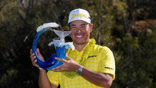 Hideki Matsuyama, of Japan, holds the champions trophy after the final round of The Sentry golf event, Sunday, Jan. 5, 2025, at Kapalua Plantation Course in Kapalua, Hawaii.