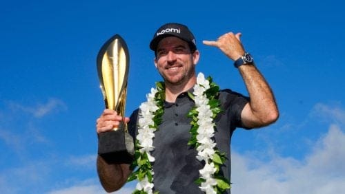 Nick Taylor, of Canada, poses with his trophy after winning the Sony Open golf event, Sunday, Jan. 12, 2025, at Waialae Country Club in Honolulu.