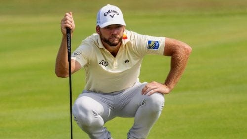 Sam Burns checks his line the seventh hole green during the third round of the Tour Championship golf tournament, Saturday, Aug. 31, 2024, in Atlanta.