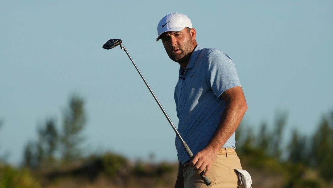 Scottie Scheffler, of the United States, watches his putt on the 17th green during the final round of the Hero World Challenge PGA Tour at the Albany Golf Club in New Providence, Bahamas, Sunday, Dec. 8, 2024.