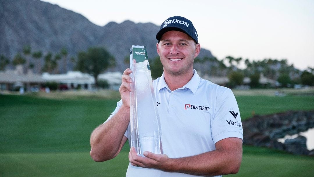 Sepp Straka holds the trophy after winning the American Express golf tournament in La Quinta, Calif., Sunday, Jan. 19, 2025.