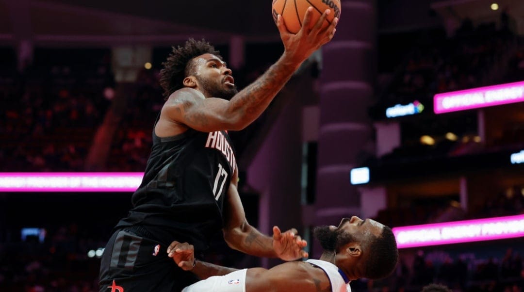 HOUSTON, TEXAS - JANUARY 20: Tari Eason #17 of the Houston Rockets goes to the basket while defended by Tim Hardaway Jr. #8 of the Detroit Pistons in the second half at Toyota Center on January 20, 2025 in Houston, Texas. NOTE TO USER: User expressly acknowledges and agrees that, by downloading and/or using this photograph, user is consenting to the terms and conditions of the Getty Images License Agreement.