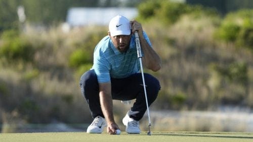 Scottie Scheffler, of the United States, lines up his put on the 16th hole green during the final round of the Hero World Challenge PGA Tour at the Albany Golf Club, in New Providence, Bahamas, Sunday, Dec. 3, 2023. (AP Photo/Fernando Llano)