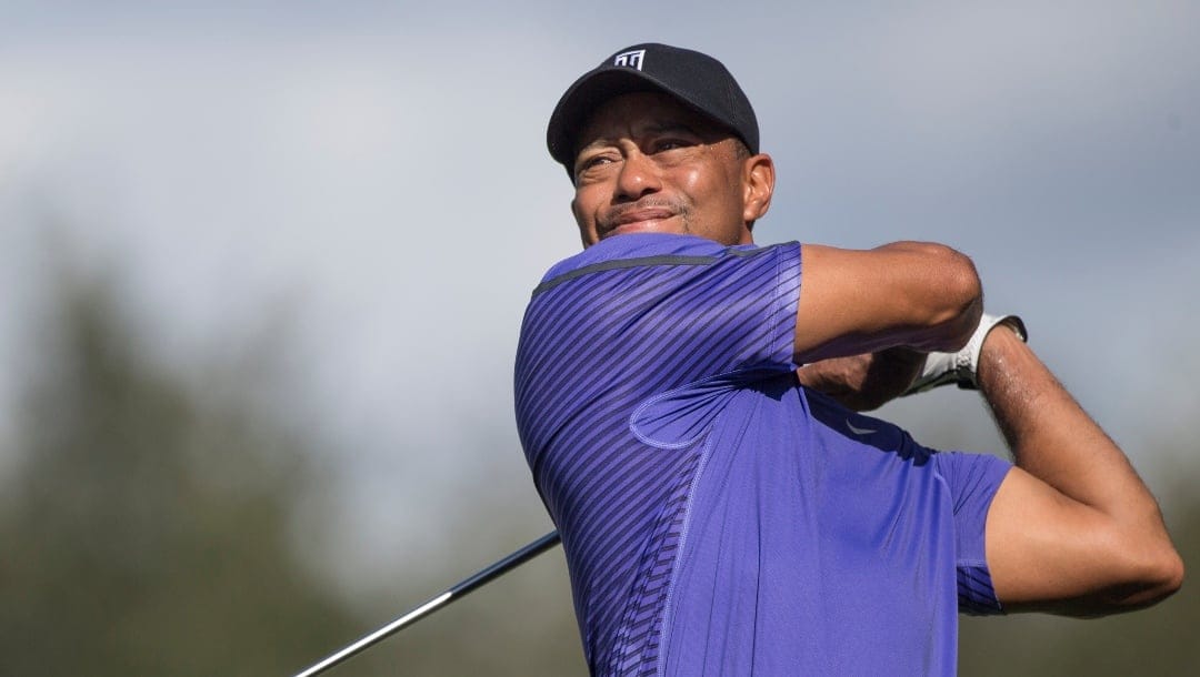 Tiger Woods tees off on the seventh hole during the third round of the Hero World Challenge golf tournament on Saturday, Dec. 6, 2014, in Windermere, Fla.