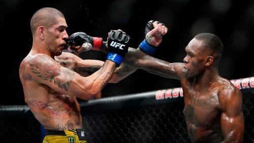 Nigeria's Israel Adesanya, right, punches Brazil's Alex Pereira during the third round of a middleweight bout title bout.