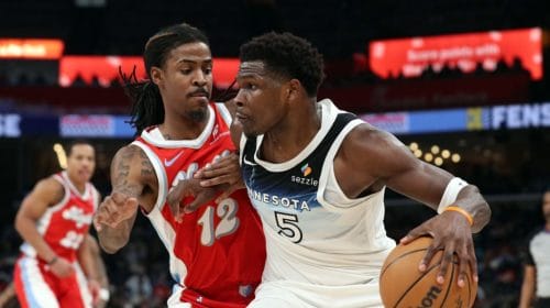 MEMPHIS, TENNESSEE - JANUARY 20: Anthony Edwards #5 of the Minnesota Timberwolves handles the ball against Ja Morant #12 of the Memphis Grizzlies during the first half at FedExForum on January 20, 2025 in Memphis, Tennessee. NOTE TO USER: User expressly acknowledges and agrees that, by downloading and or using this photograph, User is consenting to the terms and conditions of the Getty Images License Agreement.