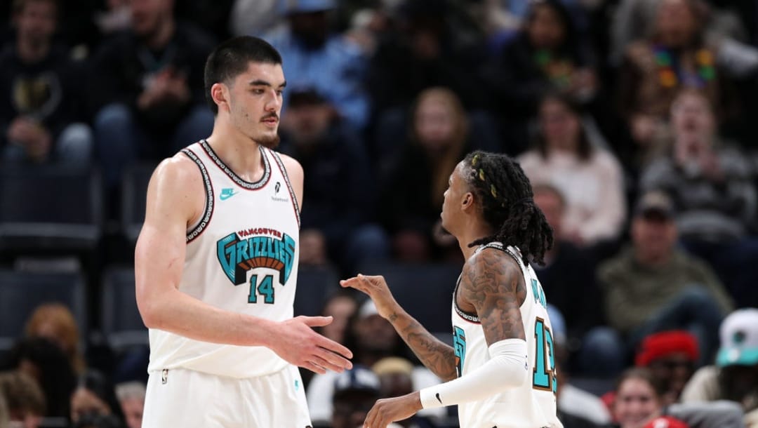 MEMPHIS, TENNESSEE - DECEMBER 23: Ja Morant #12 of the Memphis Grizzlies and Zach Edey #14 of the Memphis Grizzlies talks during the game LA Clippers at FedExForum on December 23, 2024 in Memphis, Tennessee. NOTE TO USER: User expressly acknowledges and agrees that, by downloading and or using this photograph, User is consenting to the terms and conditions of the Getty Images License Agreement.