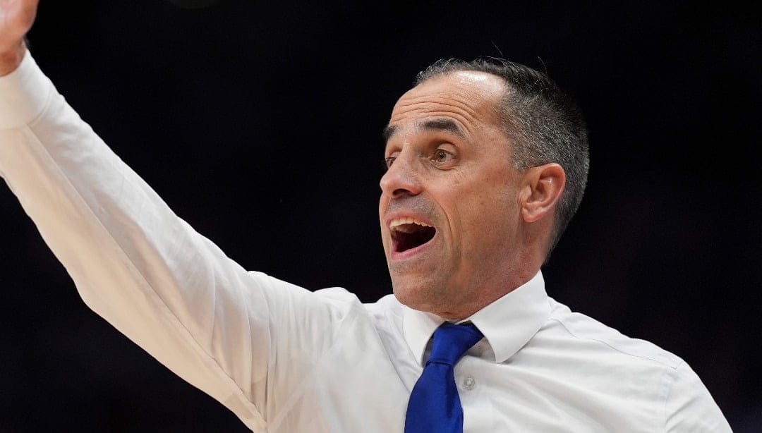 Drake head coach Ben McCollum watches during the first half of an NCAA college basketball game against Kansas State, Tuesday, Dec. 17, 2024, in Kansas City, Mo. (AP Photo/Charlie Riedel)