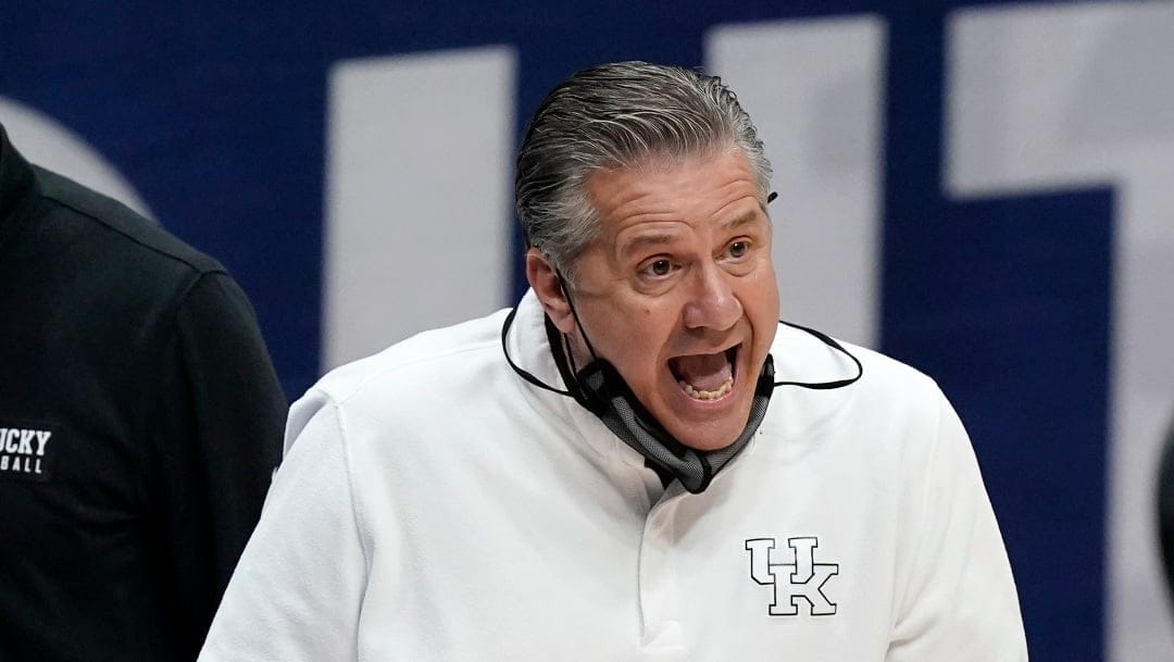 Kentucky head coach John Calipari yells to his players in the first half of an NCAA college basketball game against Mississippi State in the Southeastern Conference Tournament Thursday, March 11, 2021, in Nashville, Tenn.