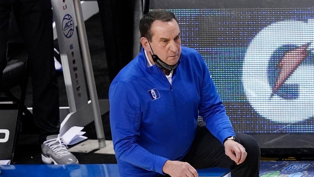 Duke head coach Mike Krzyzewski watches the action during the second half of an NCAA college basketball game against Louisville in the second round of the Atlantic Coast Conference tournament in Greensboro, N.C., Wednesday, March 10, 2021.