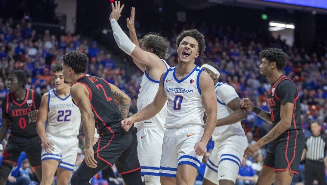 Boise State's Julian Bowie (0) celebrates after a made basket during the first half of an NCAA college basketball game against San Diego State in Boise, Idaho, Saturday, Jan 4, 2025.