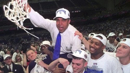 Kentucky coach Tubby Smith is carried off the court by game MVP Jeff Sheppard, left, Steve Masiello, center right, and Jamaal Maglioire second from right front after beating Utah 78-69 in the Final Four NCAA championship game at the Alamodome in San Antonio Monday, March 30, 1998.