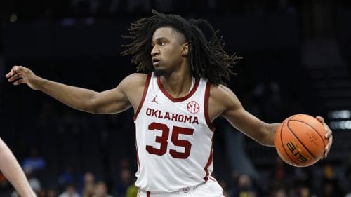 Oklahoma forward Glenn Taylor Jr. looks to pass during the second half of an NCAA college basketball game against Michigan in Charlotte, N.C., Wednesday, Dec. 18, 2024.