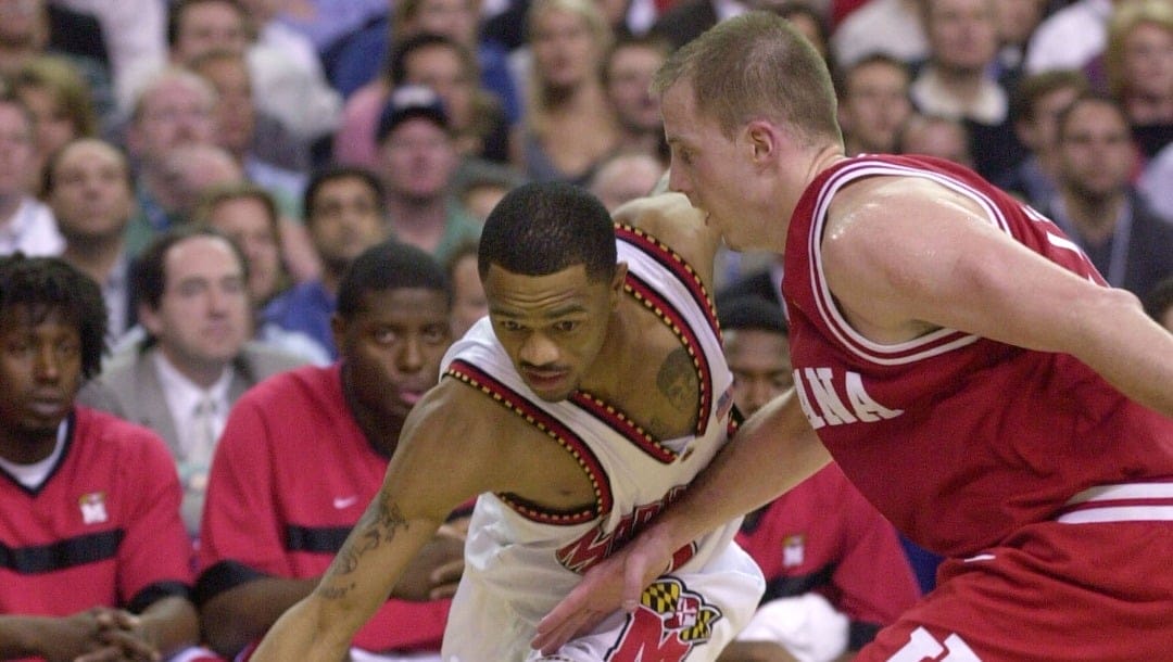 Maryland's Juan Dixon dribbles past Indiana's Dane Fife in second half action in the NCAA men's championship final in Atlanta, Ga. Monday, April 1, 2002. Dixon was the game's Most Valuable Player as Maryland defeated Indiana 64-62.