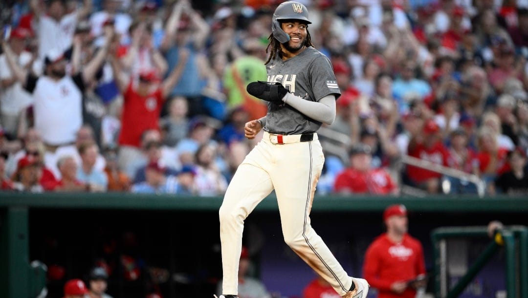 Washington Nationals' James Wood runs towards home to score a run on a single by Keibert Ruiz during the eighth inning of a baseball game against the Philadelphia Phillies, Saturday, Sept. 28, 2024, in Washington. The Nationals won 6-3.