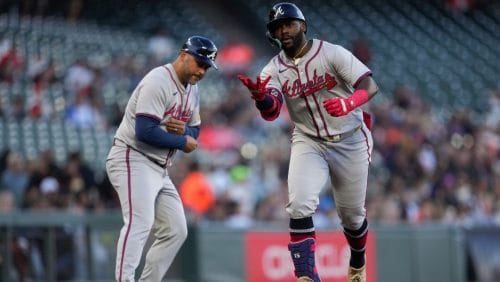 Atlanta Braves' Michael Harris II, right, celebrates with third base coach Matt Tuiasosopo after hitting a grand slam against the San Francisco Giants during the first inning of a baseball game Wednesday, Aug. 14, 2024, in San Francisco.