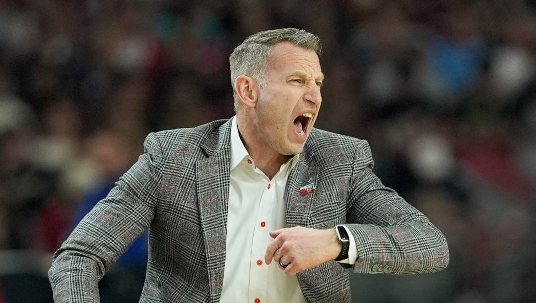 Alabama head coach Nate Oats reacts during the first half of the NCAA college basketball game against UConn at the Final Four, Saturday, April 6, 2024, in Glendale, Ariz.