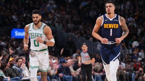 Jayson Tatum #0 of the Boston Celtics and Michael Porter Jr. #1 of the Denver Nuggets looks on during the game on January 7, 2025 at Ball Arena in Denver, Colorado.