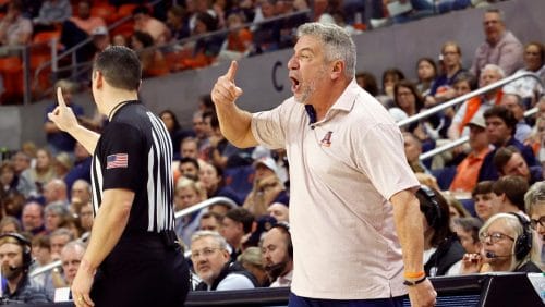 Auburn head coach Bruce Pearl, right, reacts after a call during the second half of an NCAA college basketball game against Florida, Saturday, Feb. 8, 2025, in Auburn, Ala.