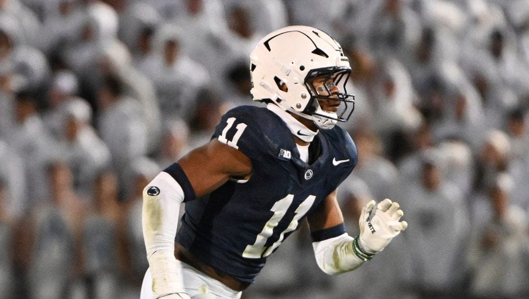 Penn State defensive end Abdul Carter (11) pass rushes during the third quarter of an NCAA college football game against Washington, Saturday, Nov. 9, 2024, in State College, Pa.