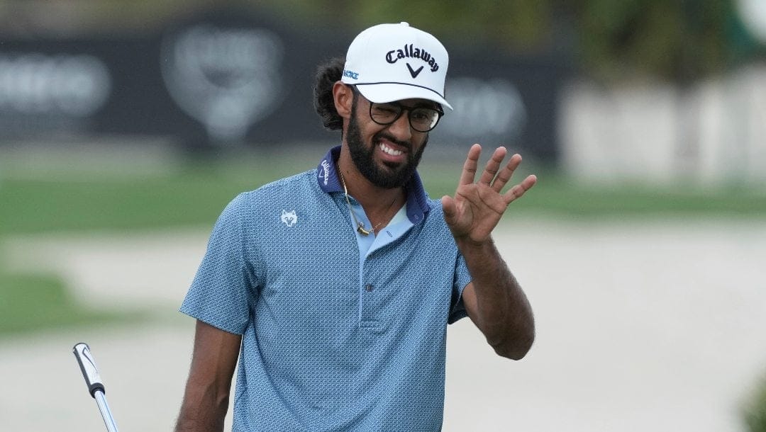 Akshay Bhatia, of the United States, lines up his putt on the second green during the third round of the Hero World Challenge PGA Tour at the Albany Golf Club, in New Providence, Bahamas, Saturday, Dec. 7, 2024.