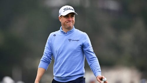 Justin Thomas waves to spectators after putting on the sixth hole at Pebble Beach Golf Links during the second round of the AT&T Pebble Beach Pro-Am golf tournament, Friday, Jan. 31, 2025, in Pebble Beach, Calif.