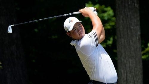 Joohyung Kim, of South Korea, also known as Tom Kim, tees off on the second hole during the final round of the Wyndham Championship golf tournament in Greensboro, N.C., Sunday, Aug. 7, 2022. Kim will compete on the International team at the Presidents Cup beginning Thursday, Sept. 22.