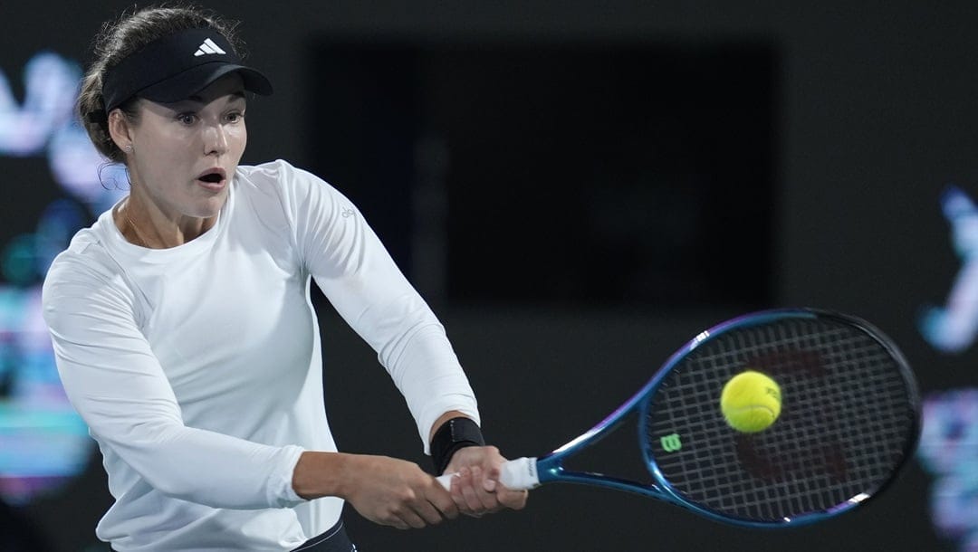 Anna Kalinskaya returns the ball to Jasmine Paolini of Italy during the final match of the Dubai Duty Free Tennis Championships in Dubai, United Arab Emirates, Saturday, Feb. 24, 2024.