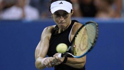 Louisa Chirico, of the United States, returns to Emma Raducanu, of Britain, at the Citi Open tennis tournament in Washington, Tuesday, Aug. 2, 2022.