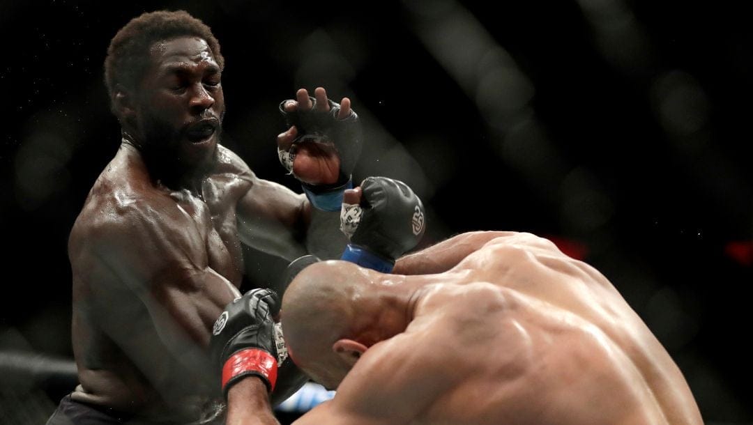 Jared Cannonier, left, throws a punch at David Branch during the second round of a middleweight mixed martial arts bout.