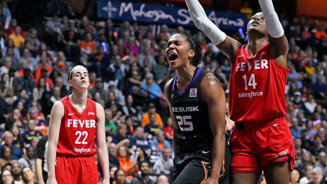 Connecticut Sun forward Alyssa Thomas (25) celebrates a basket while being fouled during the second half in Game 2 of a first-round WNBA basketball playoff series against the Indiana Fever, Sept. 25, 2024, in Uncasville, Conn.