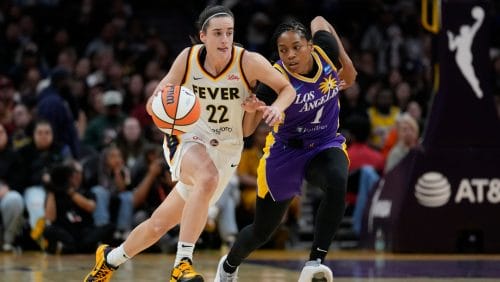 Indiana Fever guard Caitlin Clark (22) controls the ball against Los Angeles Sparks guard Zia Cooke (1) during the first half of a WNBA basketball game in Los Angeles, Friday, May 24, 2024.