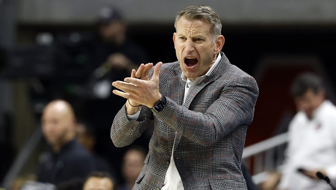 Alabama head coach Nate Oats reacts after a score against Auburn during the second half of an NCAA college basketball game, Saturday, March 8, 2025, in Auburn, Ala.