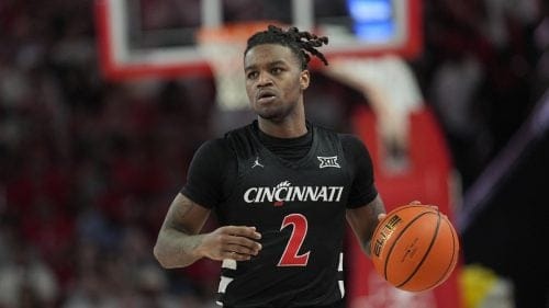 Cincinnati's Jizzle James brings the ball up the court during the first half of an NCAA college basketball game Saturday, March 1, 2025, in Houston.