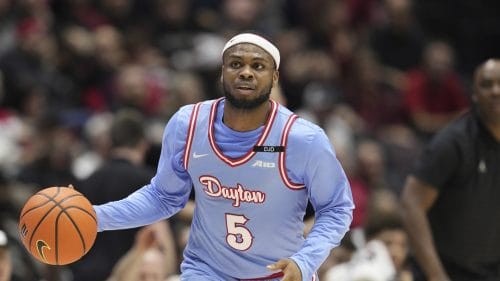 Dayton guard Posh Alexander (5) dribbles during an NCAA college basketball game against Cincinnati, Friday, Dec. 20, 2024, in Cincinnati.