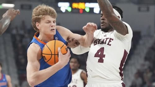 Florida forward Thomas Haugh (10) fights off a steal attempt by Mississippi State forward Cameron Matthews (4) during the first half of an NCAA college basketball game, Tuesday, Feb. 11, 2025, in Starkville, Miss.