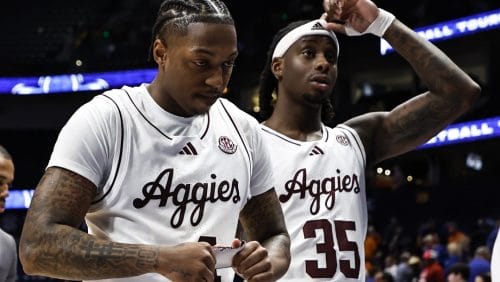 Texas A&M's Wade Taylor IV (4) and Manny Obaseki (35) walsk of the court after the second overtime in an NCAA college basketball game against Texas in the second round of the Southeastern Conference tournament, Thursday, March 13, 2025, in Nashville, Tenn.