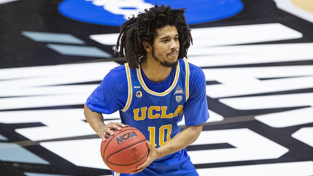 UCLA's Tyger Campbell (10) looks to pass during a First Round game against Michigan State in the NCAA men's college basketball tournament, Friday, March 19, 2021, at Mackey Arena in West Lafayette, Ind. UCLA won 86-80.