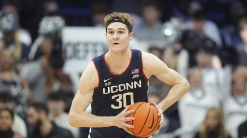 Connecticut forward Liam McNeeley (30) plays against Butler in the first half of an NCAA college basketball game in Indianapolis, Saturday, Dec. 21, 2024.