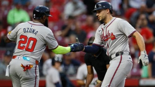 Atlanta Braves' Matt Olson, right, celebrates his home run against the Cincinnati Reds with teammate Marcell Ozuna during the first inning of a baseball game, Tuesday, Sept. 17, 2024, in Cincinnati.