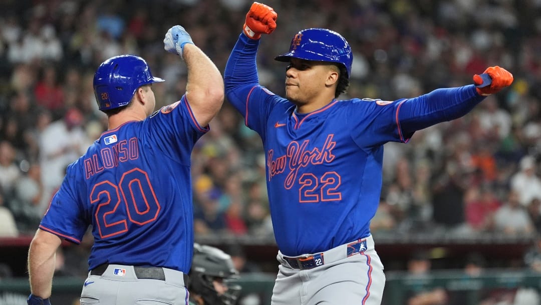 New York Mets' Juan Soto (22) celebrates his home run against the Arizona Diamondbacks with Mets' Pete Alonso (20) during the sixth inning of a baseball game Wednesday, May 7, 2025, in Phoenix.
