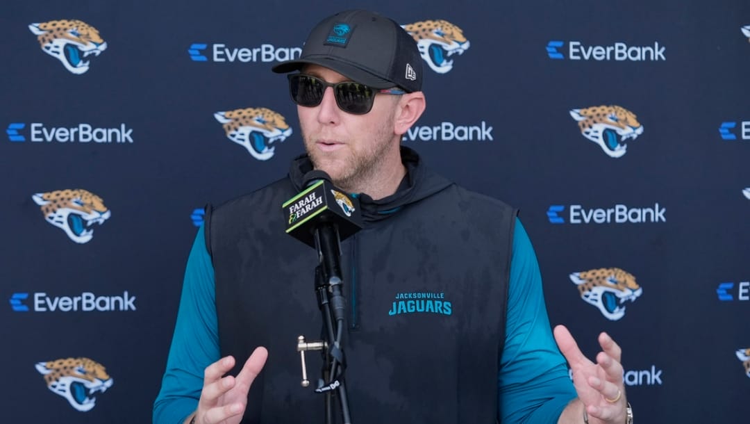 Jacksonville Jaguars head coach Liam Coen talks with reporters after practice at NFL football minicamp, Thursday, June 12, 2025, in Jacksonville, Fla.