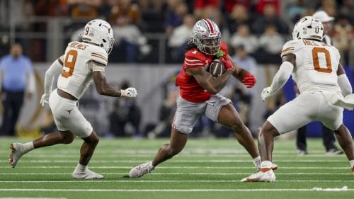 Ohio State running back Quinshon Judkins (1) rushes while chased down by Texas defensive back Gavin Holmes (9) and linebacker Anthony Hill Jr. (0) during the Cotton Bowl College Football Playoff semifinal game, Friday, Jan. 10, 2025, in Arlington, Texas.