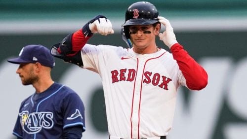 Boston Red Sox rookie Roman Anthony celebrates after his two RBI double, his first major league hit, during the first inning of a baseball game against the Tampa Bay Rays at Fenway Park, Tuesday, June 10, 2025, in Boston.