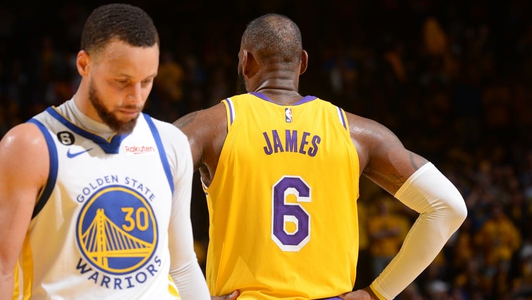 SAN FRANCISCO, CA - MAY 10: LeBron James #6 of the Los Angeles Lakers and Stephen Curry #30 of the Golden State Warriors stand on the court during Game Five of the Western Conference Semi-Finals of the 2023 NBA Playoffs on May 10, 2023 at Chase Center in San Francisco, California.