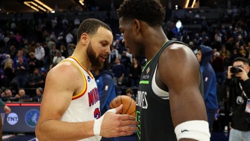 MINNEAPOLIS, MINNESOTA - JANUARY 15: Stephen Curry #30 of the Golden State Warriors and Anthony Edwards #5 of the Minnesota Timberwolves shake hands after the game at Target Center on January 15, 2025 in Minneapolis, Minnesota. The Warriors defeated the Timberwolves 116-115.