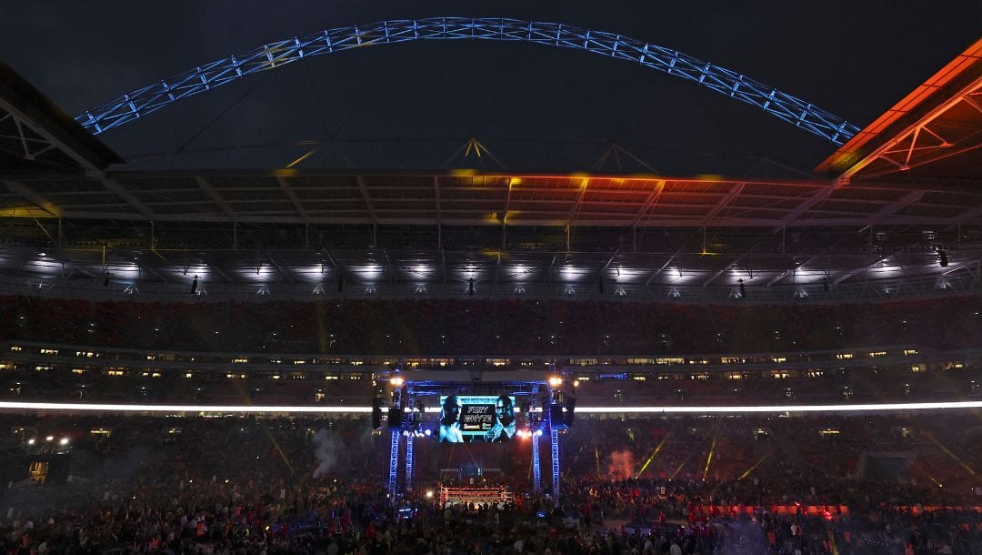 Spectators gather as Britain's Tyson Fury and Britain's Dillian Whyte prepare to enter the ring for a WBC heavyweight title.